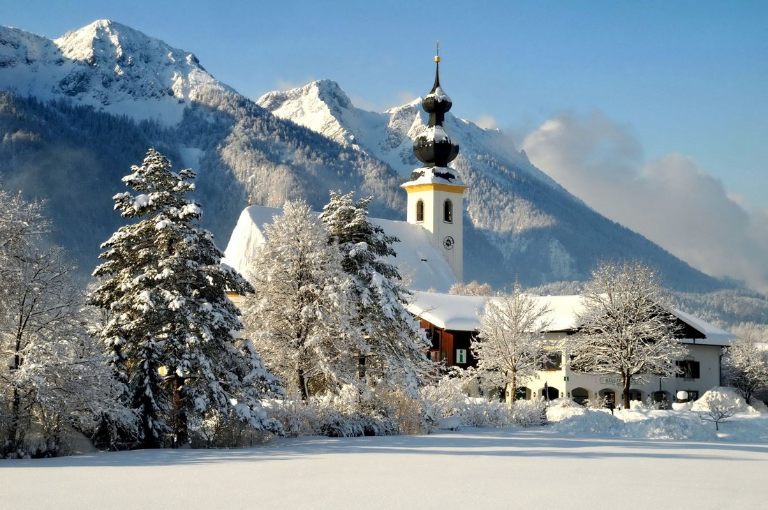 View of the snow-covered Inzell with the Bavarian Alps in the background