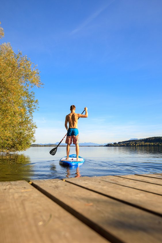Man doing stand-up paddling on the Waginger Se
