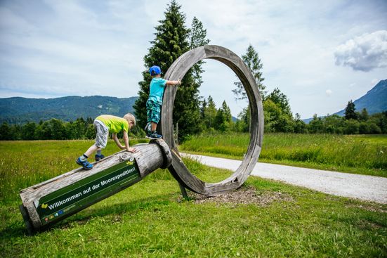Children romp on the moor adventure trail in Inzell