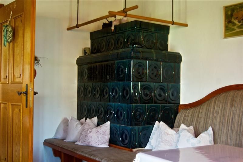 Our farmhouse parlor with classic tiled stove
