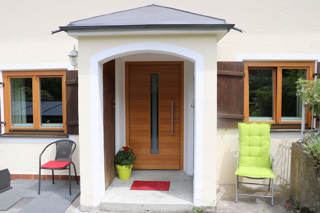 Entrance to holiday flat with porch and new front door