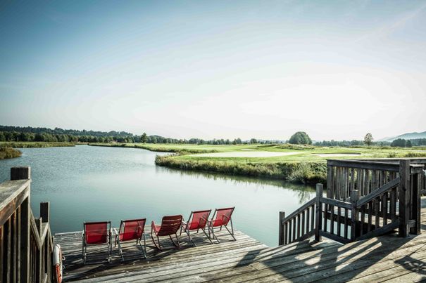 View of the water hole in the Achental golf resort in Grassau
